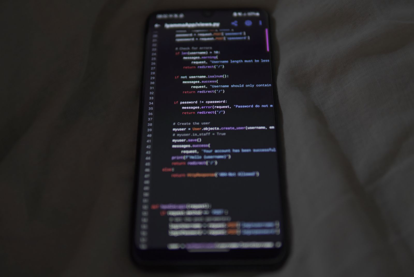 Mobile app code on a smartphone screen