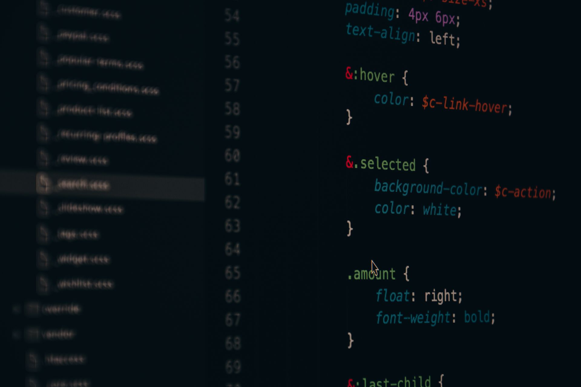Developer writing code on a laptop